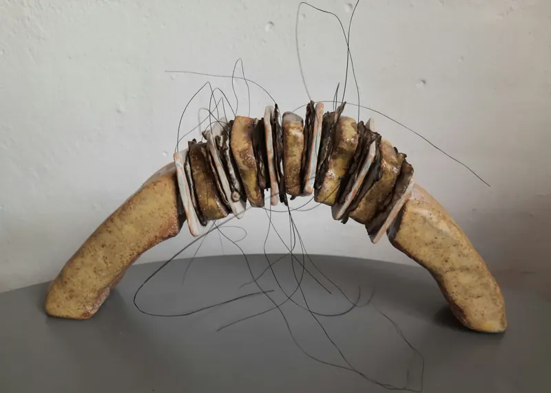 Ceramic arch sculpture bound with fine wire
