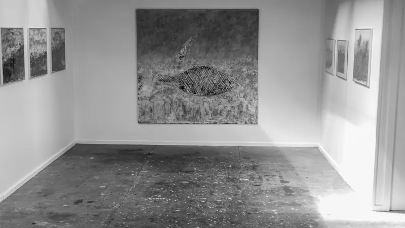 Gallery room with a large rubbing on the far wall