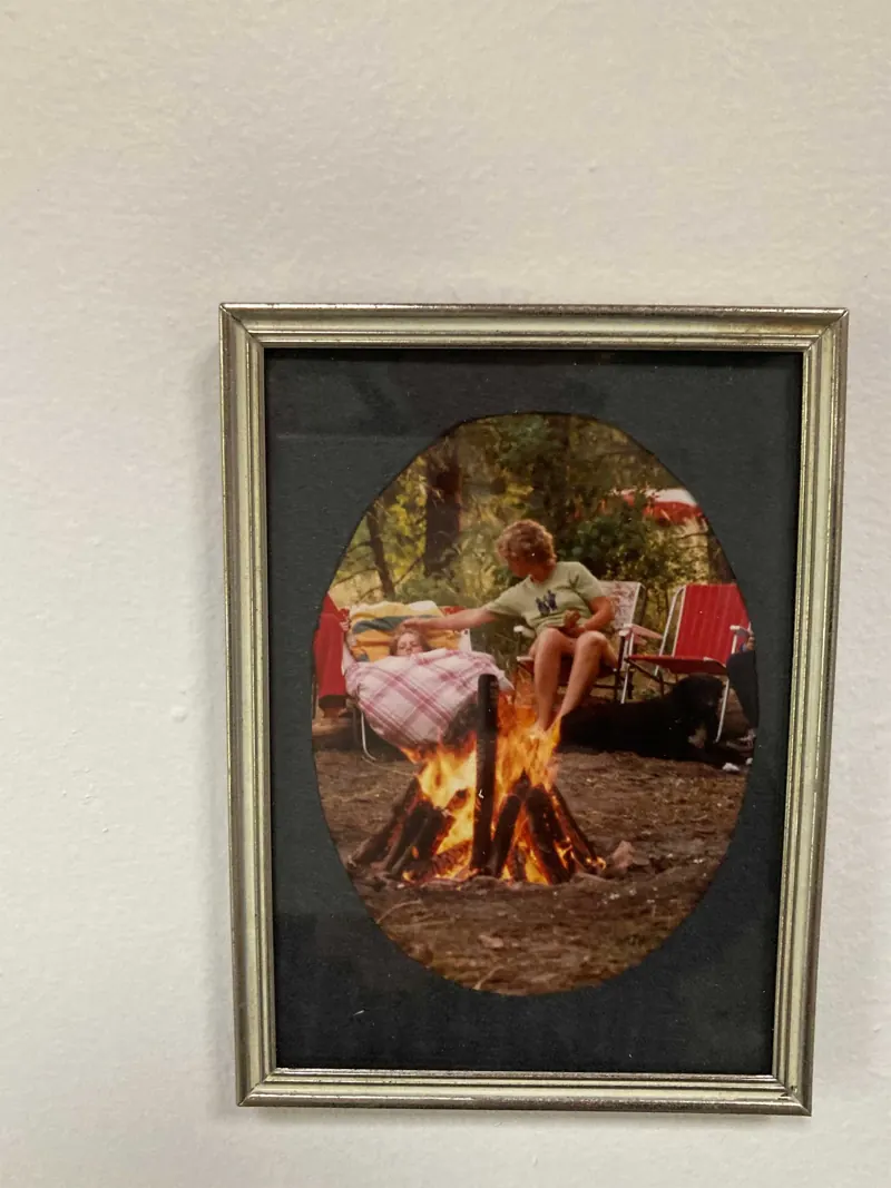 Framed oval photograph of a campfire
