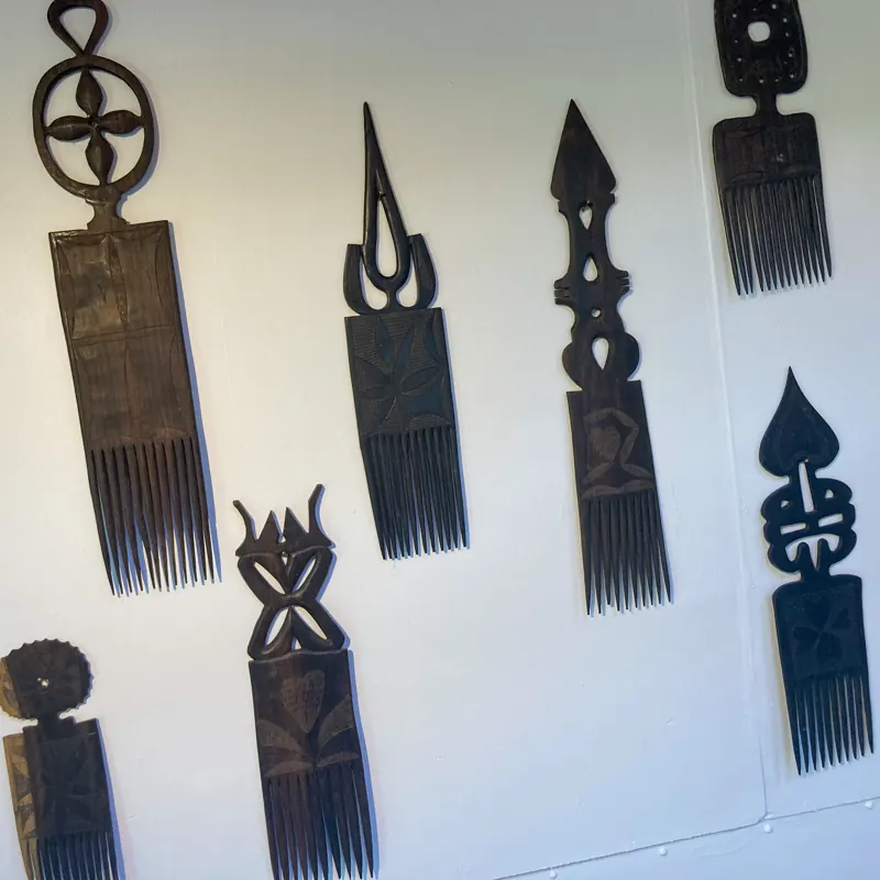 Carved wooden combs hung on the wall