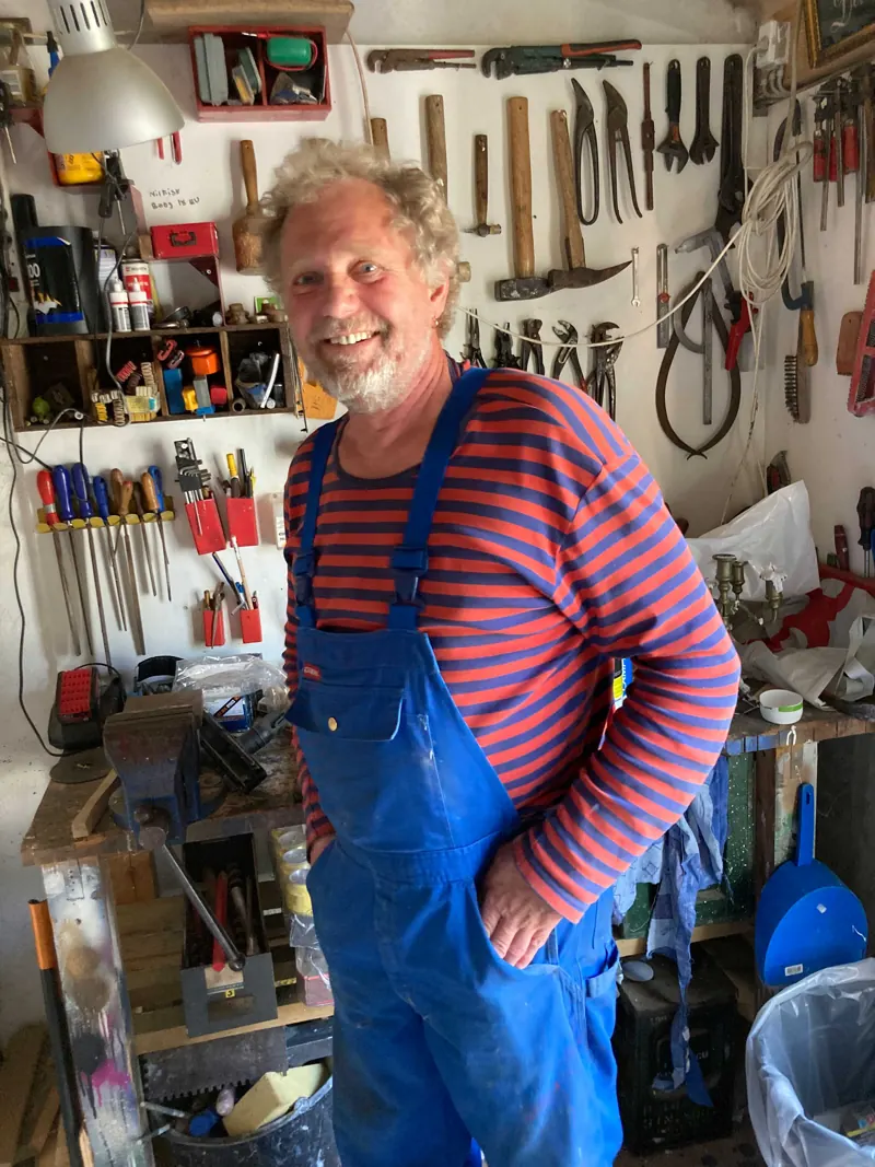 Søren Højbjerg in his workshop, surrounded by tools