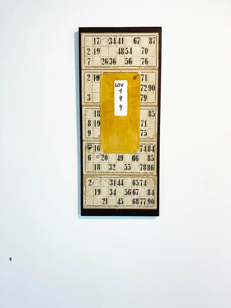 Bingo cards mounted in a tall narrow frame